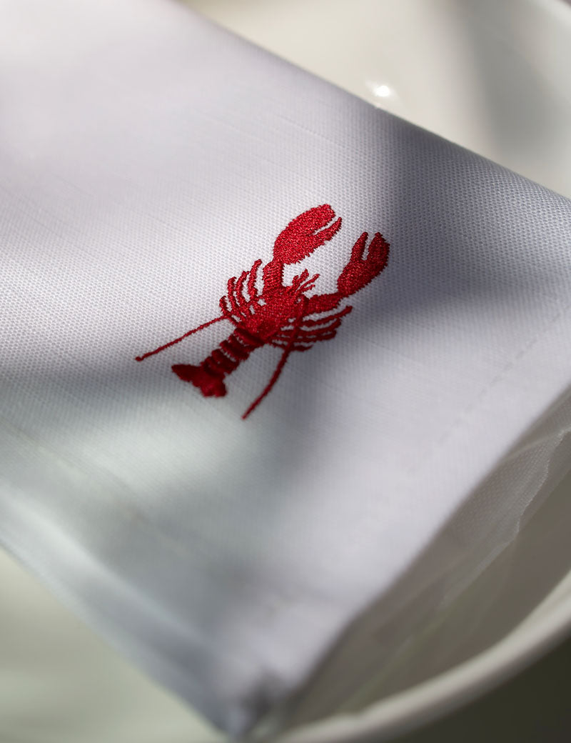 Servilletas de lino blancas con langosta bordada